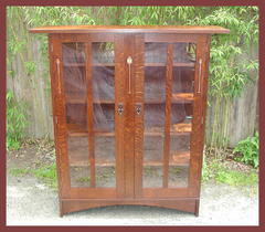 Additional view of front of china display cabinet.